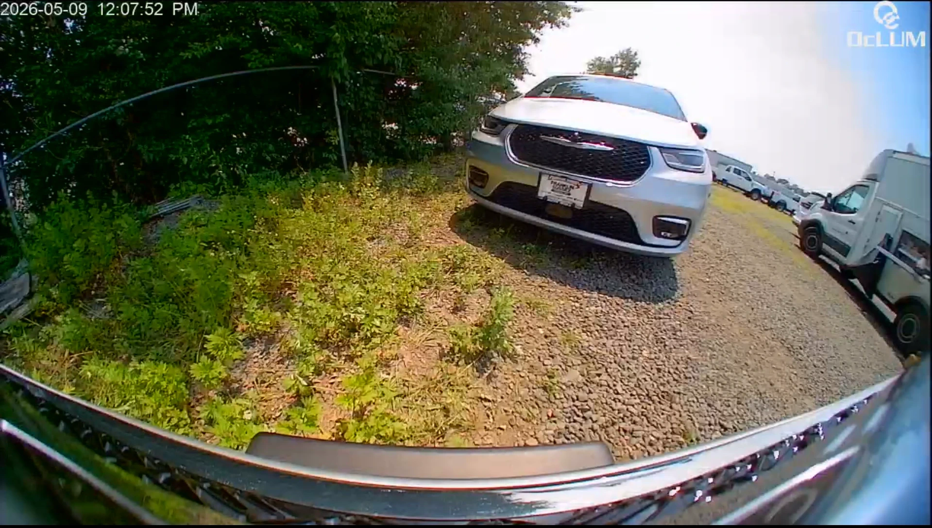 Wide exterior road and vehicle-area camera view