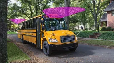 School bus with illustrated front and rear detection coverage